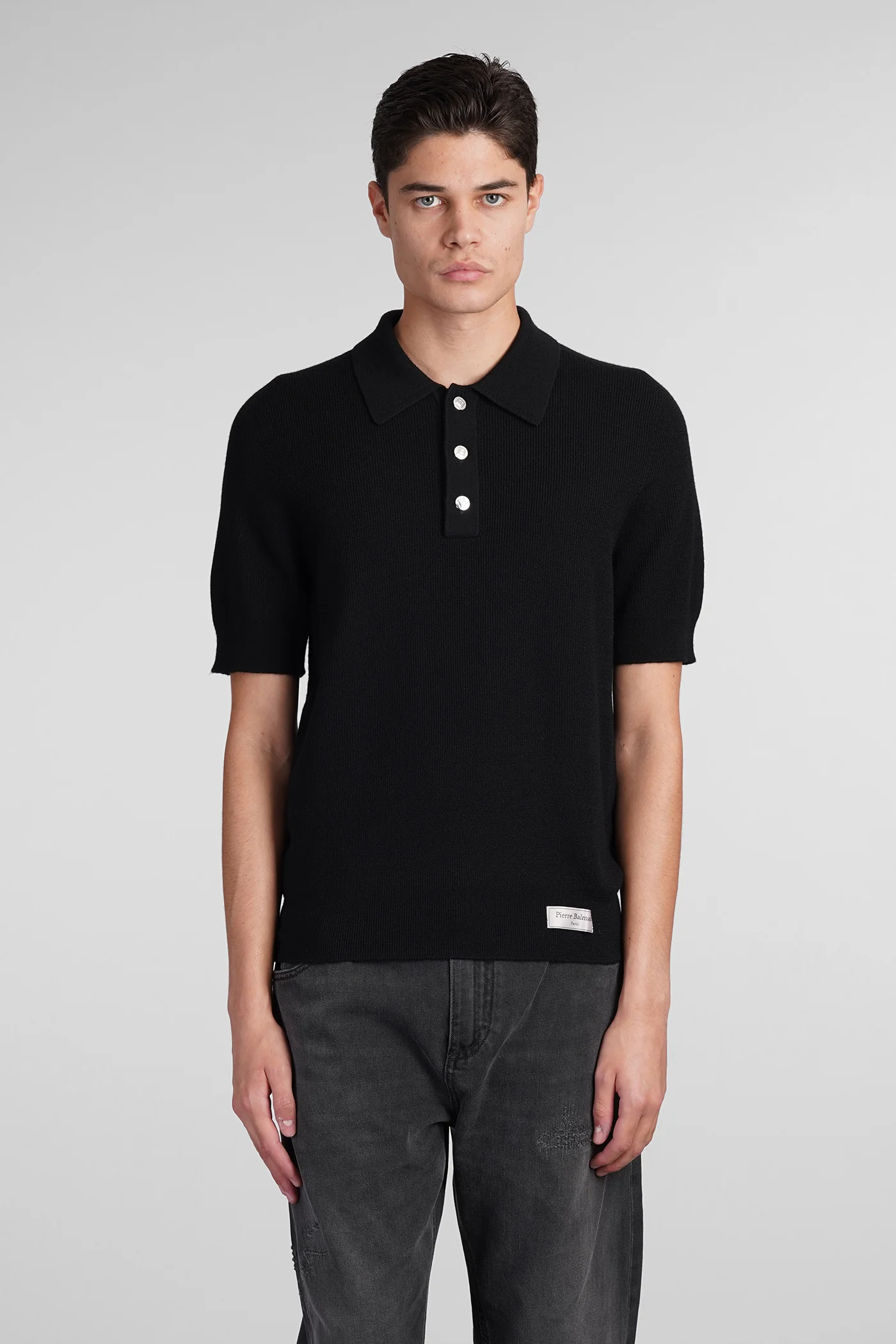 Polo in black wool