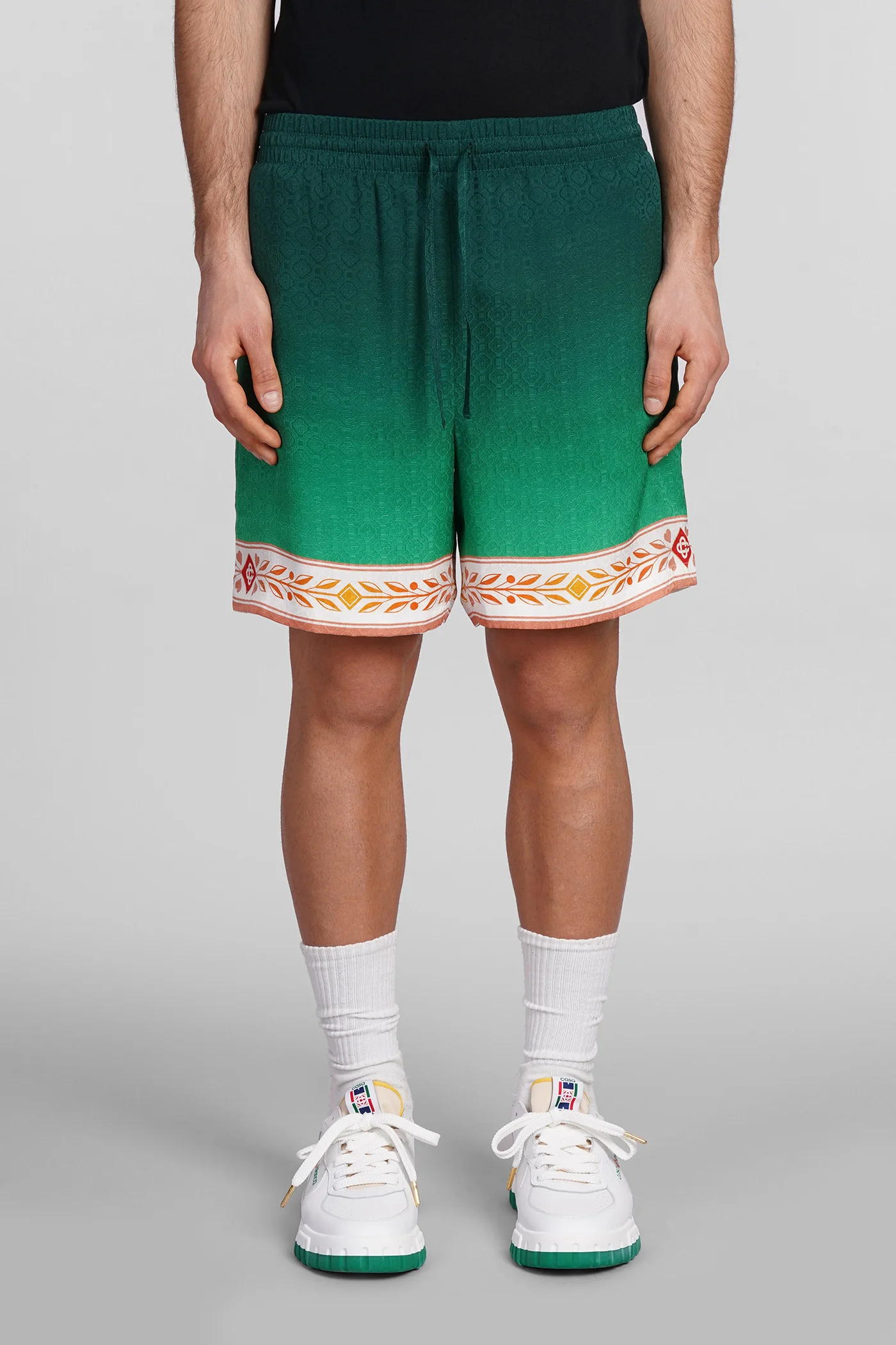 Shorts in green silk