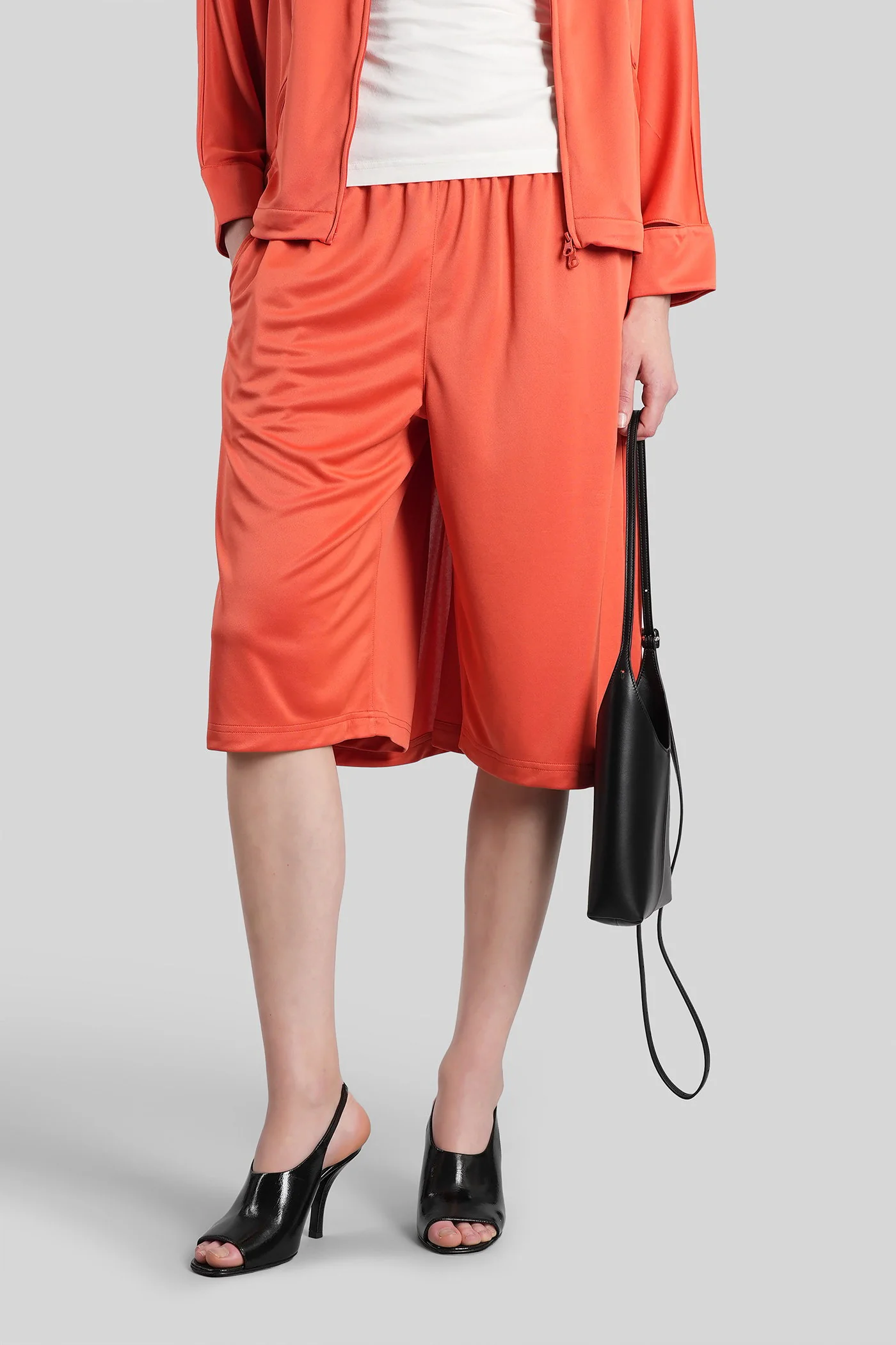 Shorts in orange polyester