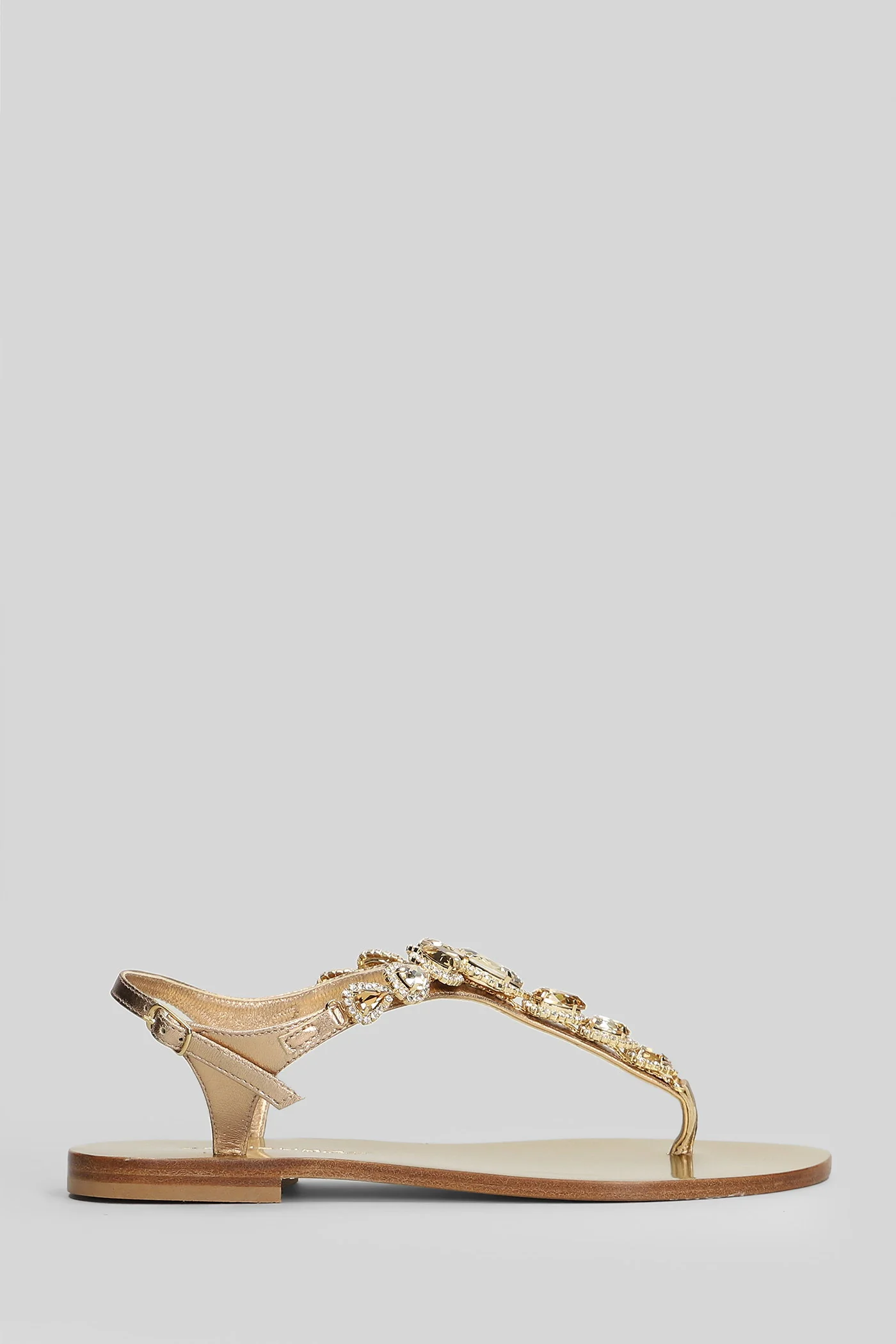 Flat sandal-slipper in platinum leather