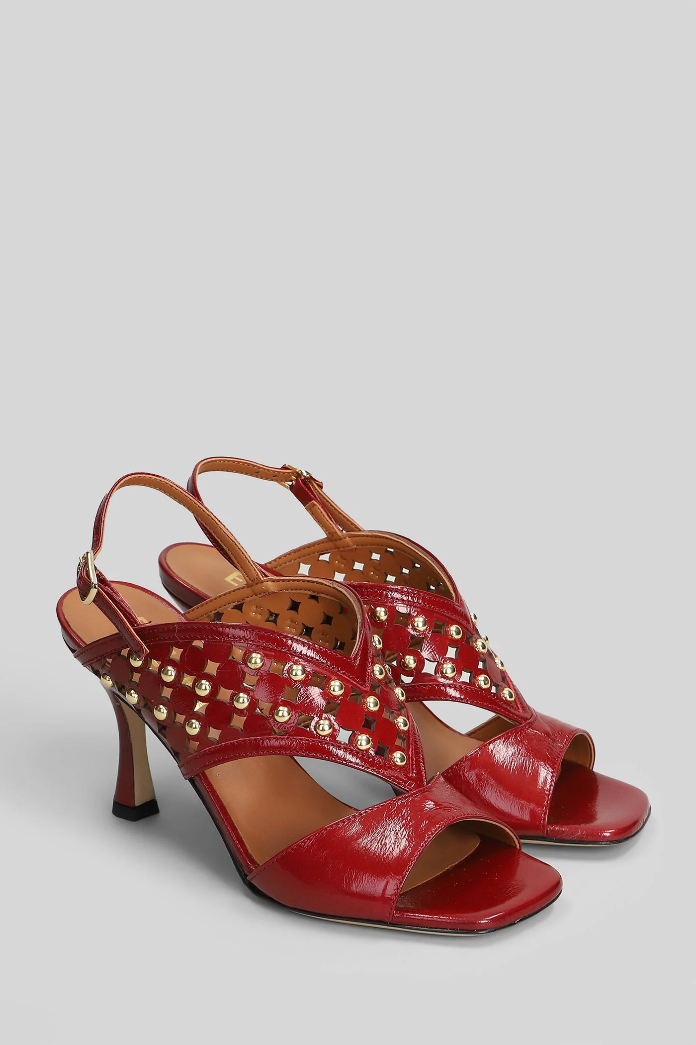 Sandals in red leather