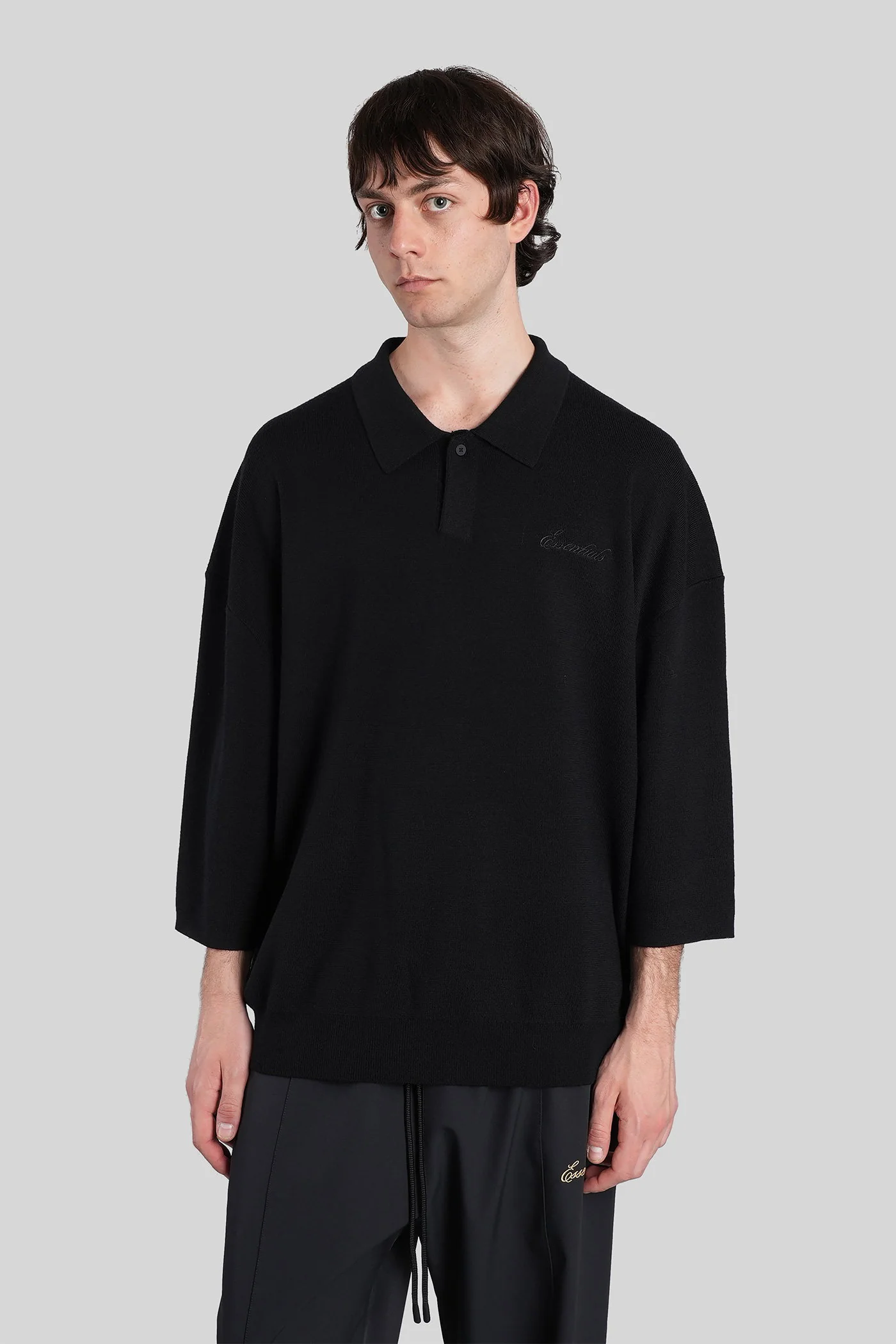 Polo in black wool