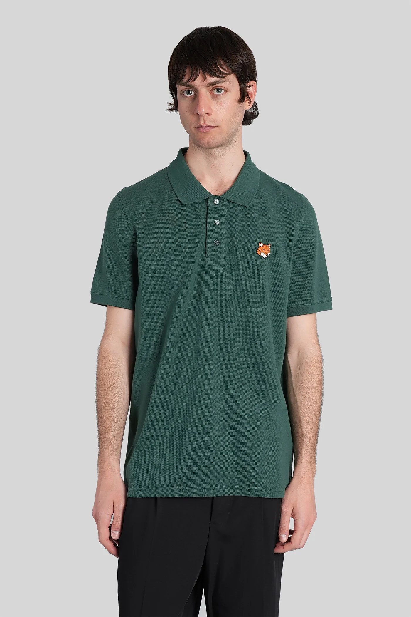 Polo in green cotton