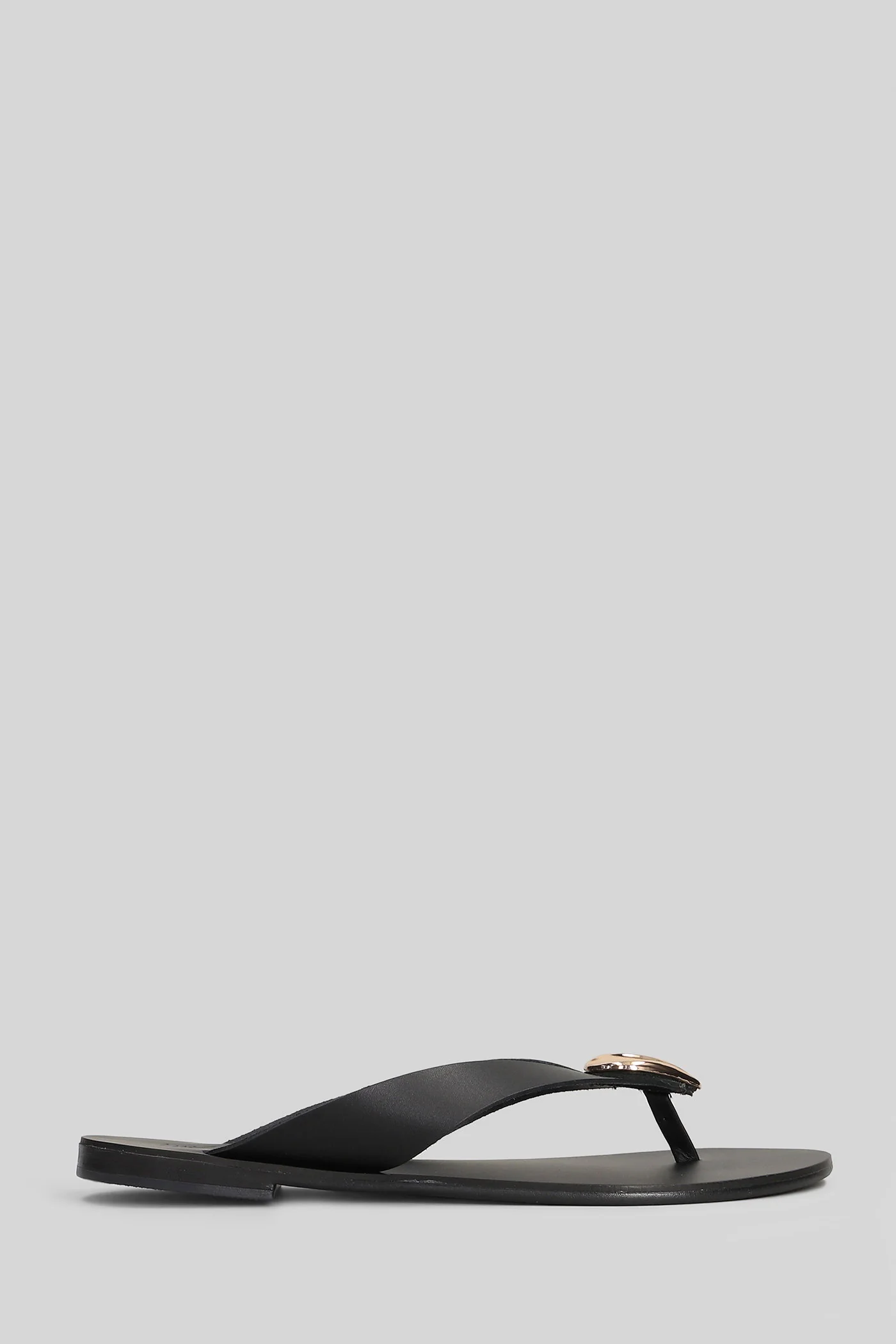 Flat sandal-slipper in black leather
