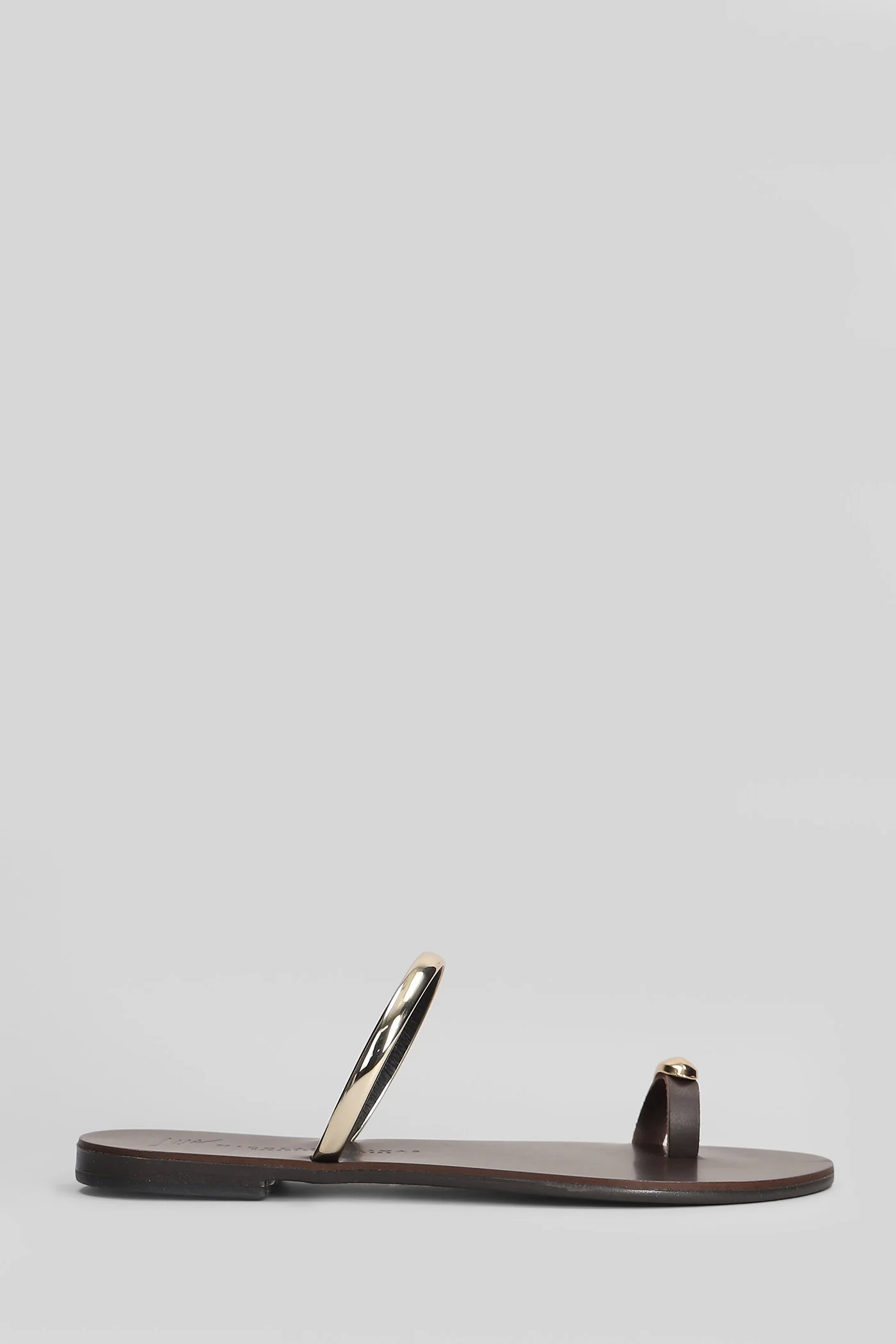 Flat sandal-slipper in brown leather