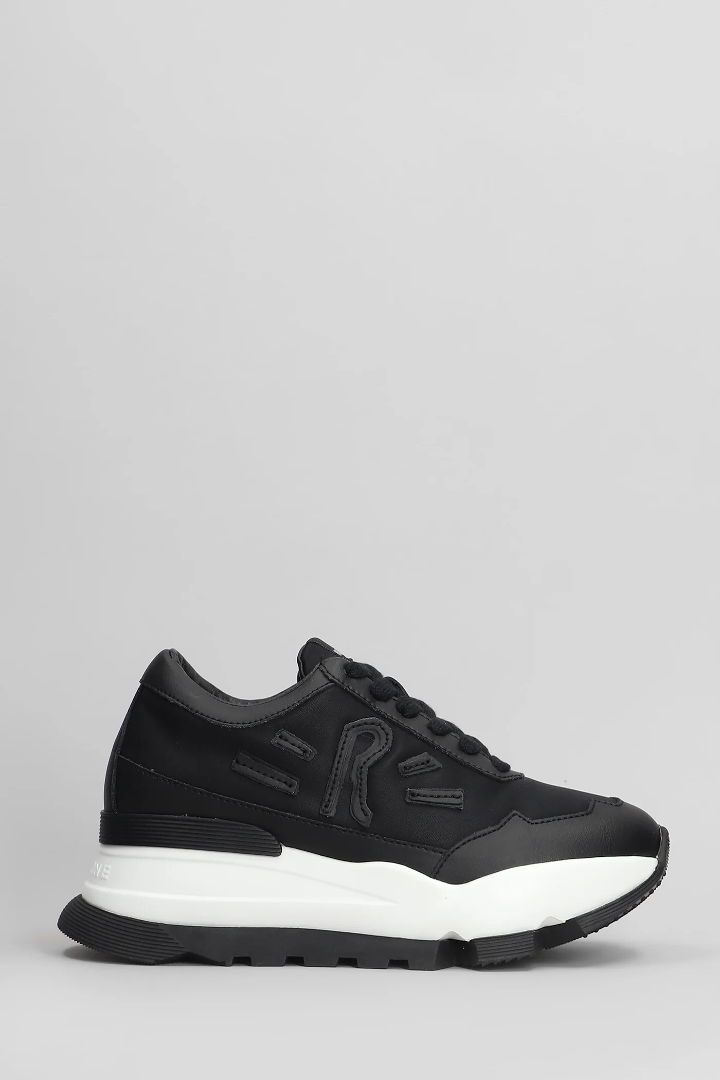 Aki Sneakers in black leather and fabric